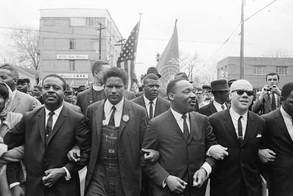 Civil rights marchers arm in arm